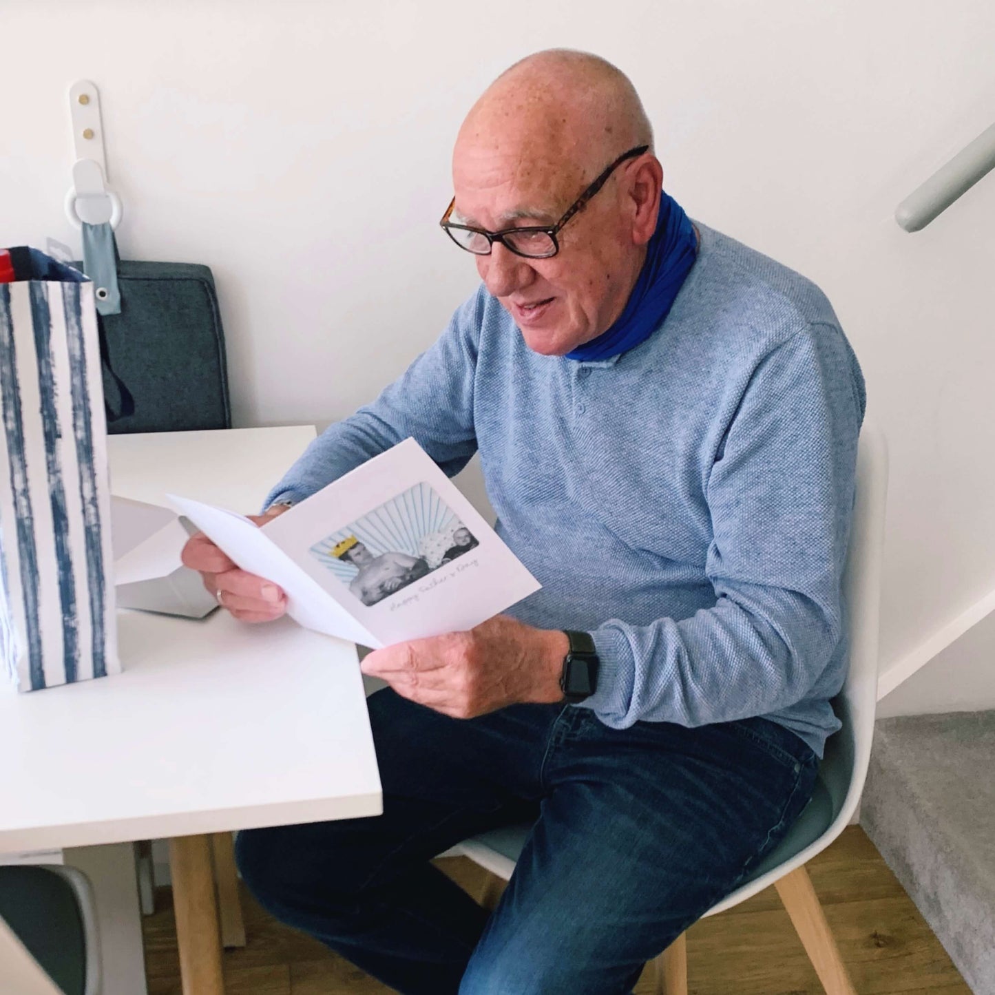 A man opening his Father's day card
