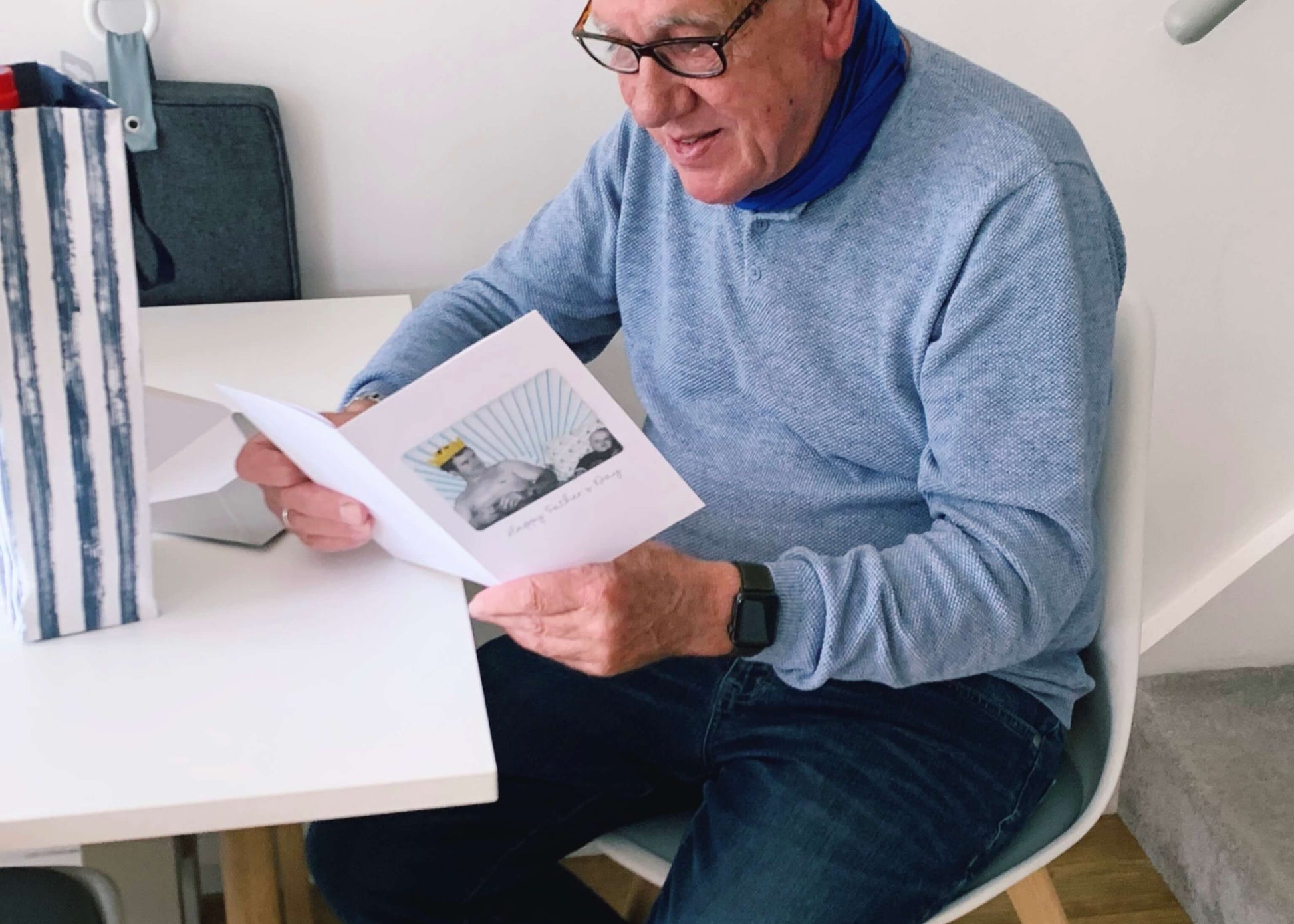 A man opening his Father's day card