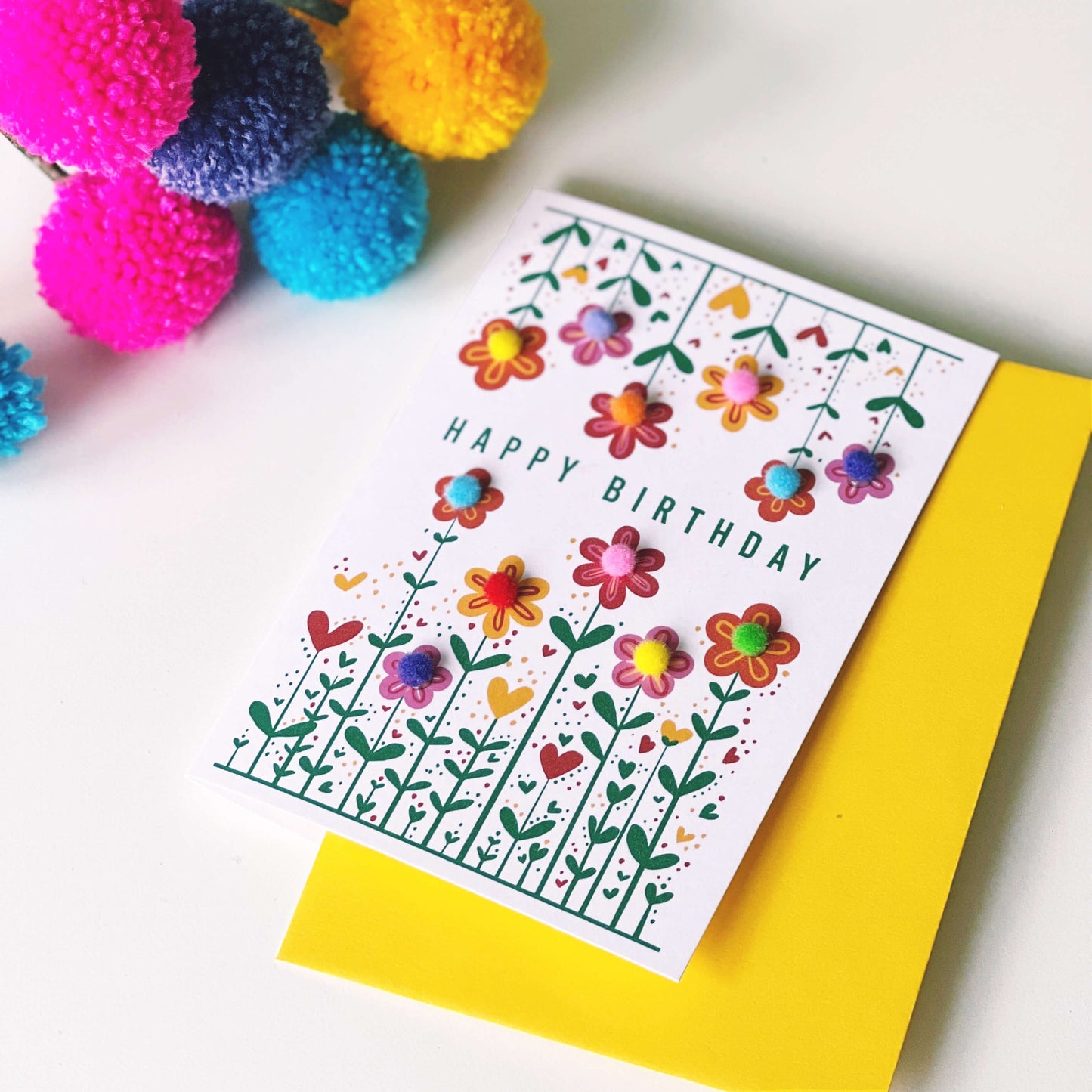 Pom Pom flower birthday card with a yellow envelope.