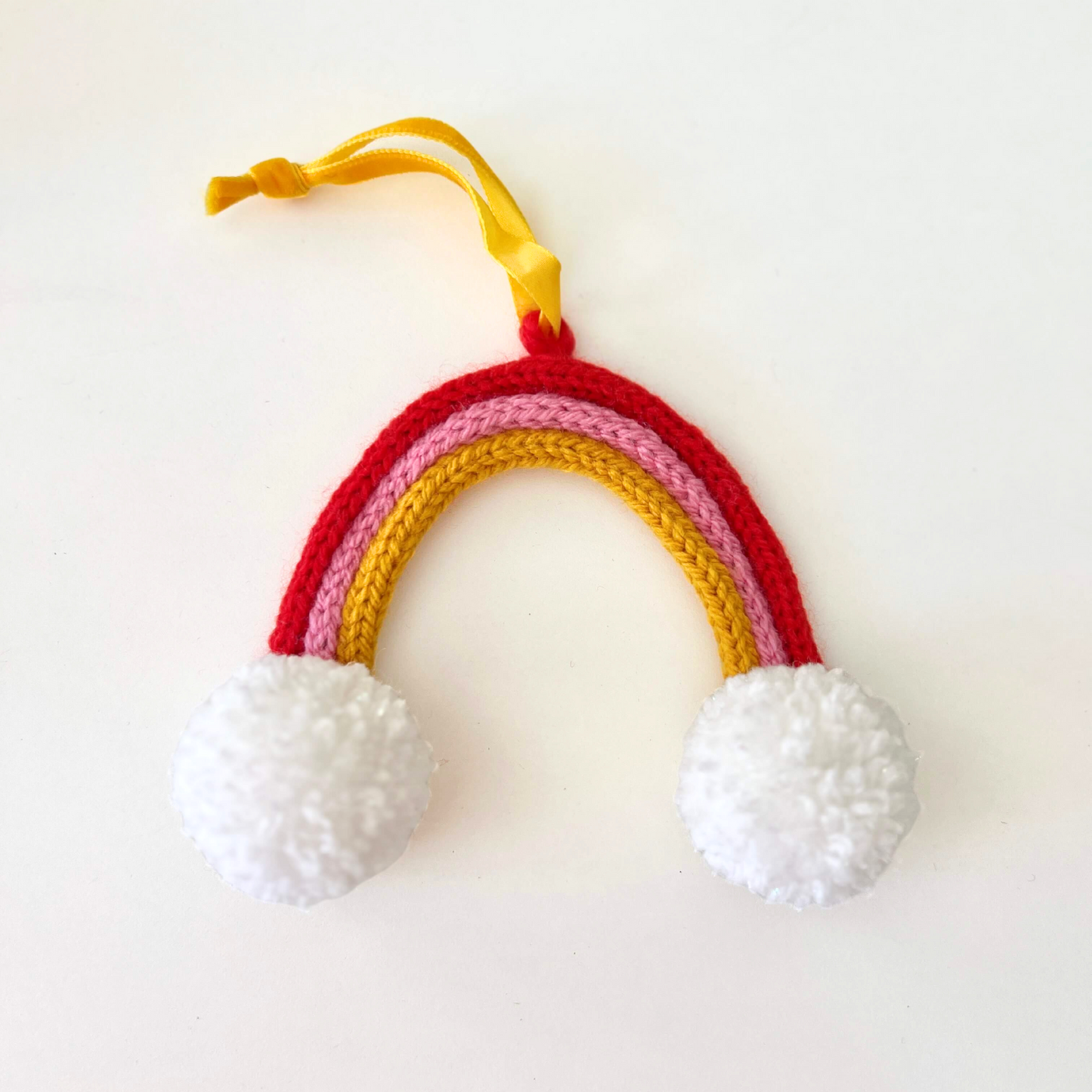 Knitted Rainbow - Pink, Red & Yellow with Pom Poms