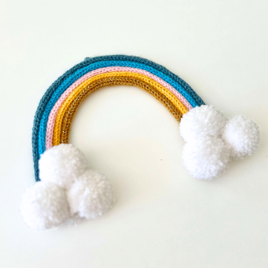 Knitted Rainbow - Blue, Pink, Yellow & Gold with Pom Poms.
