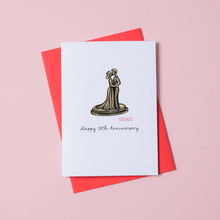 Load image into Gallery viewer, A white card with a picture of a bronze statue of a couple embracing. Under the bronze statue are the words Happy 19th Anniversary and the card is on top of a red envelope.