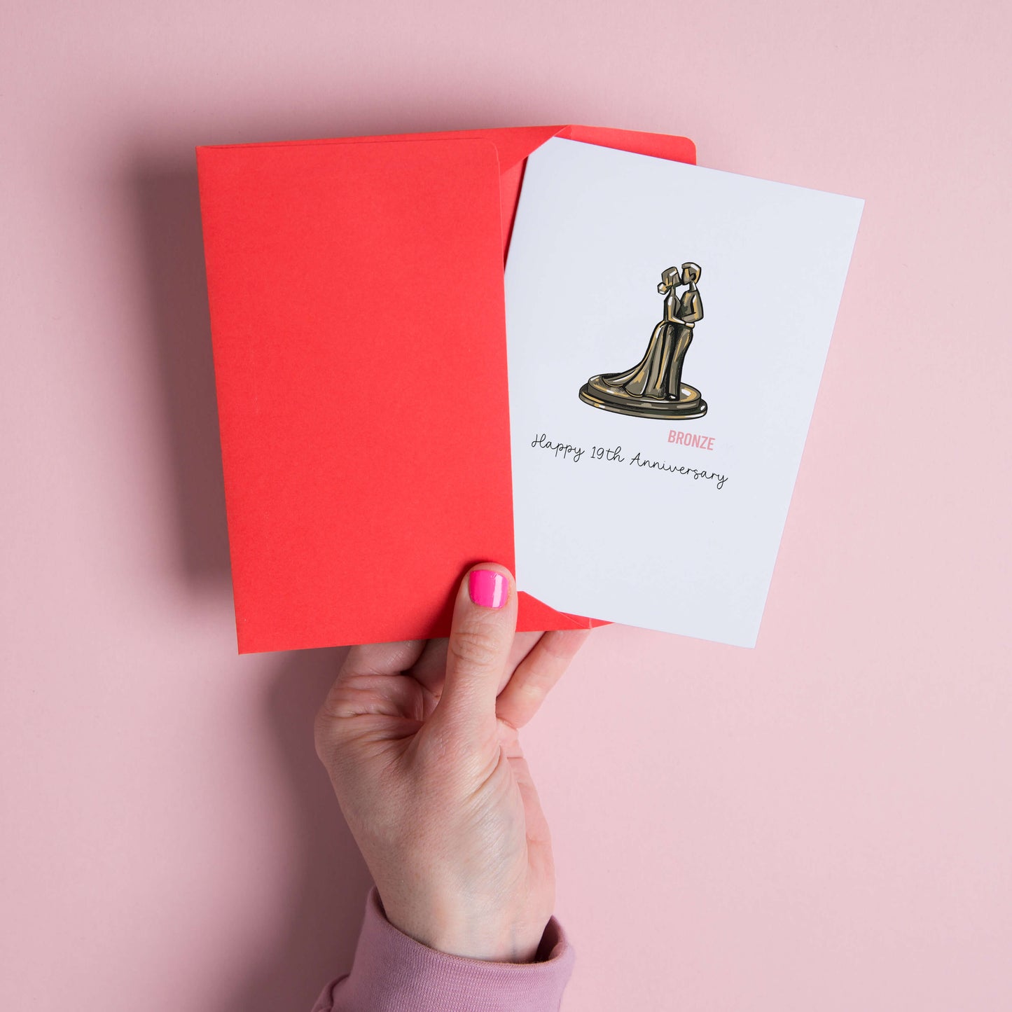 19th anniversary card illustrated for a milestone wedding anniversary, featuring a bronze statue of a couple kissing to represent bronze – the traditional gift for 19 years of marriage.