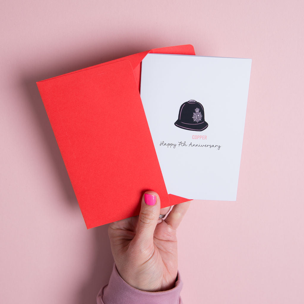 Copper anniversary card 7th year illustrated copper theme UK. There is an illustration of a police helmet for 'Copper" A funny card for a seventh wedding anniversary.