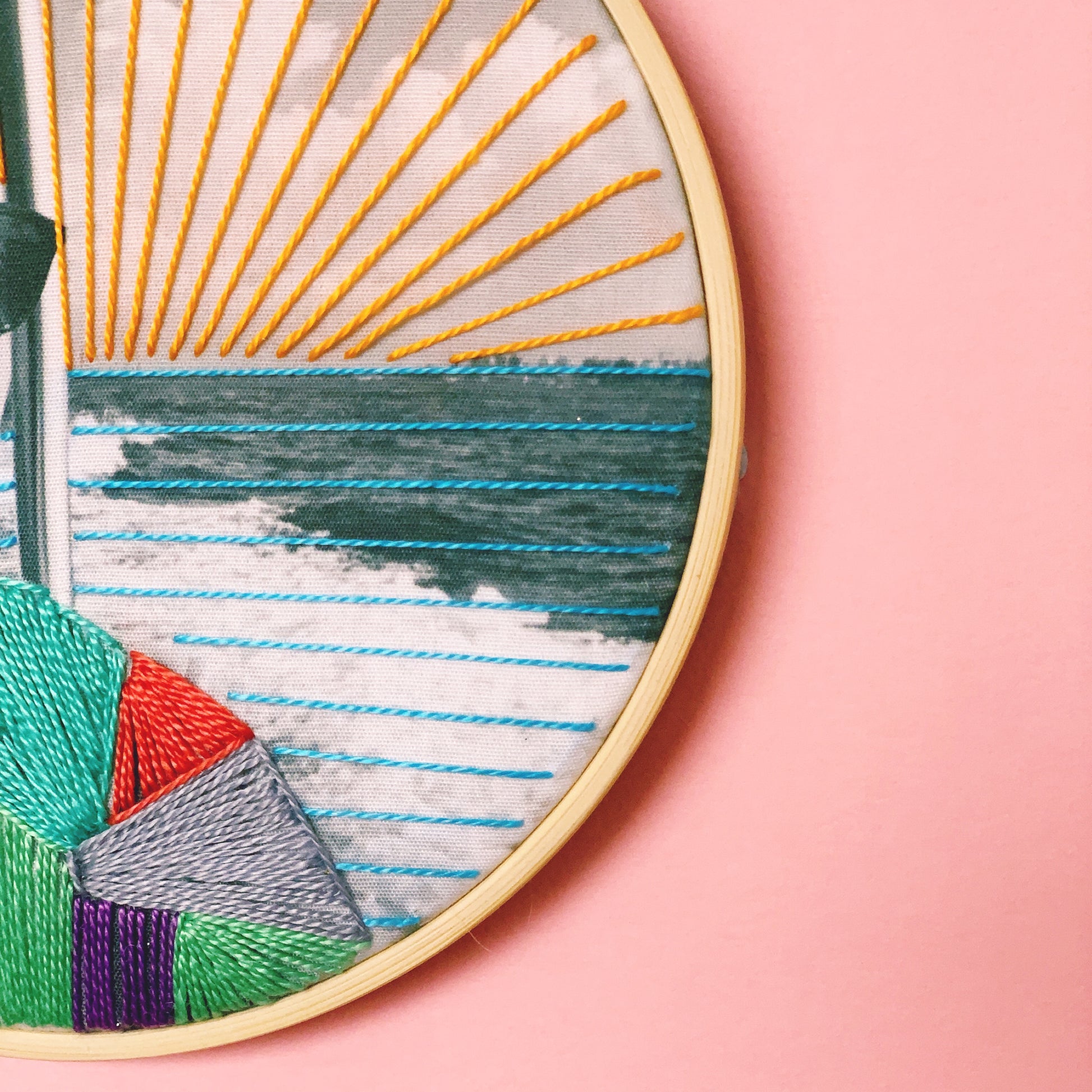 Close up of colourful embroidery detail on photo gift presented in an embroidery hoop. You can see all the stitching in great detail.