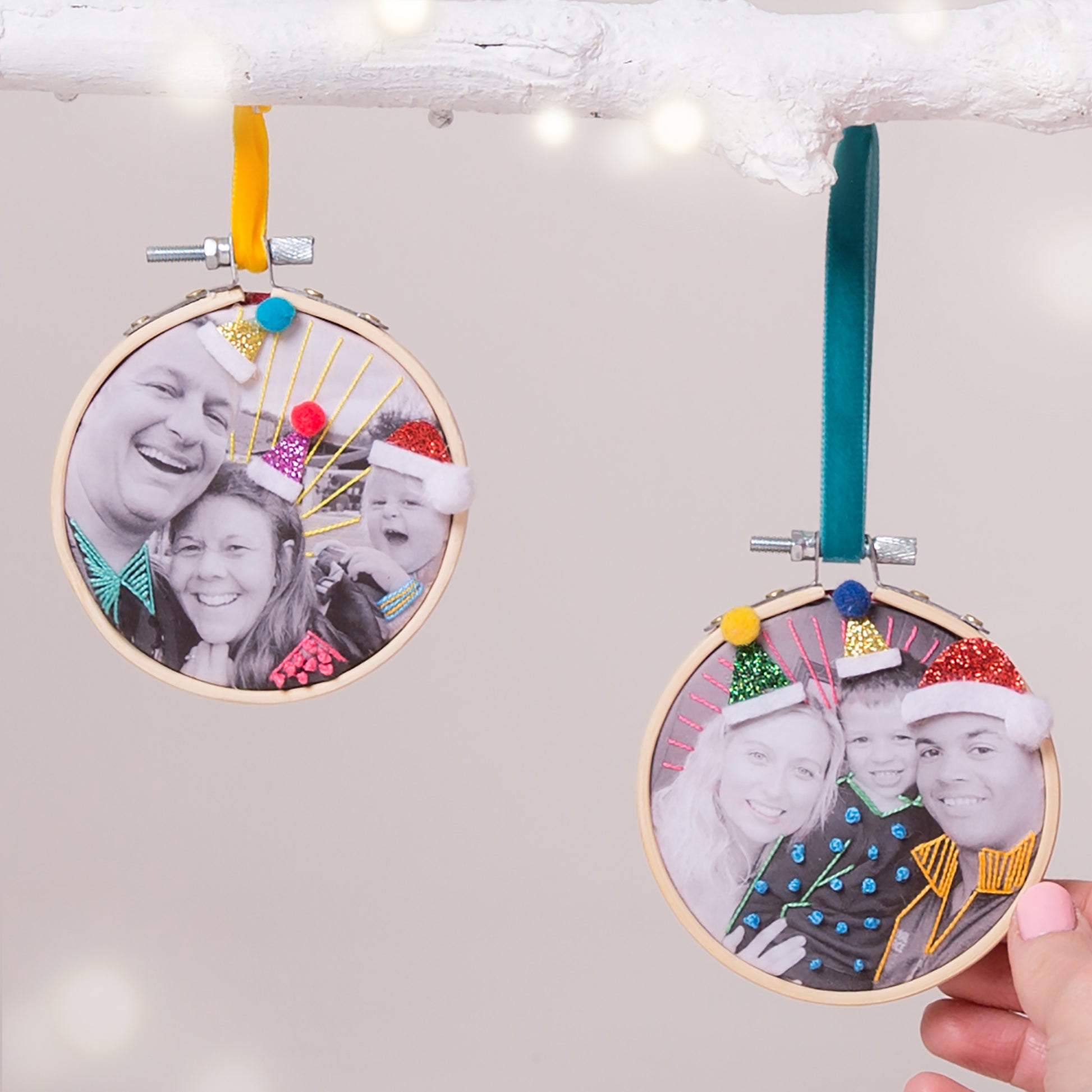 Stitched family photos in a small embroidery hoop and hung from a Christmas tree as a unique bauble decoration.