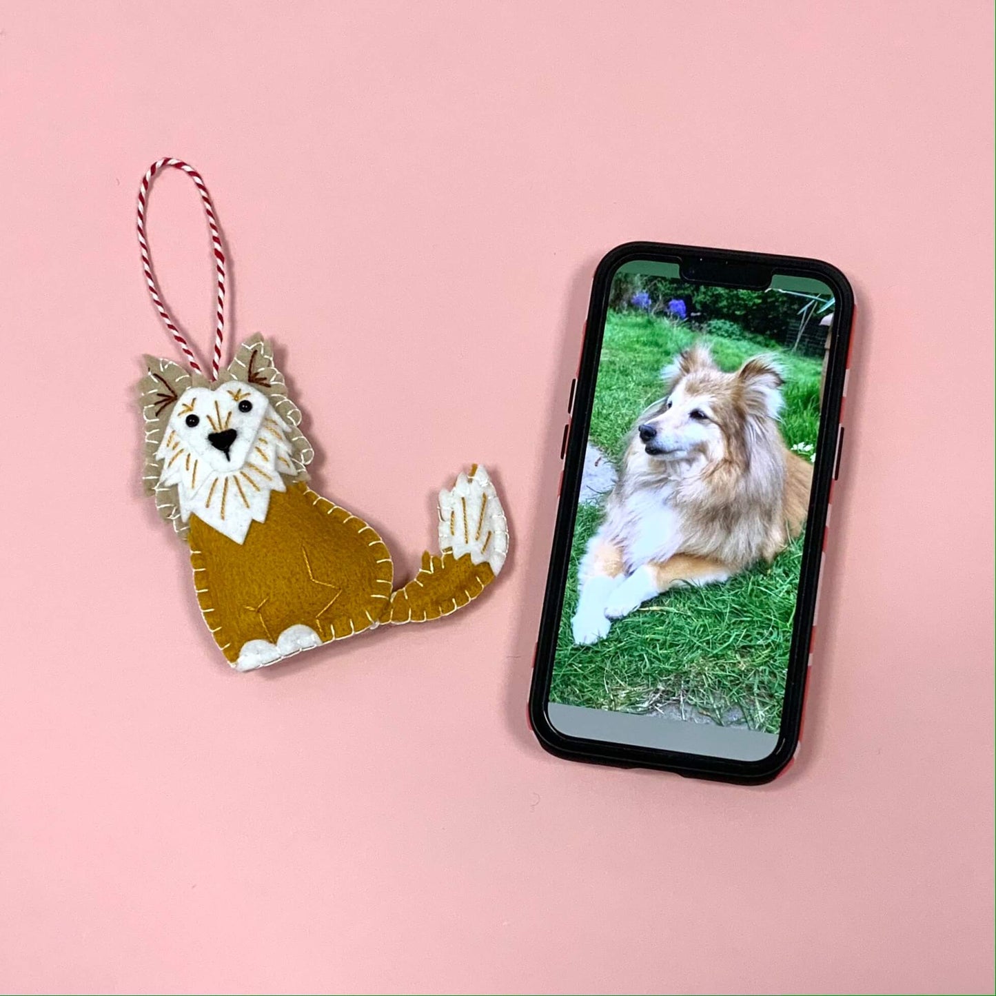 A finished ornament of a rough collie (lassie dog) next to a photo of the actual dog to show the likeness.