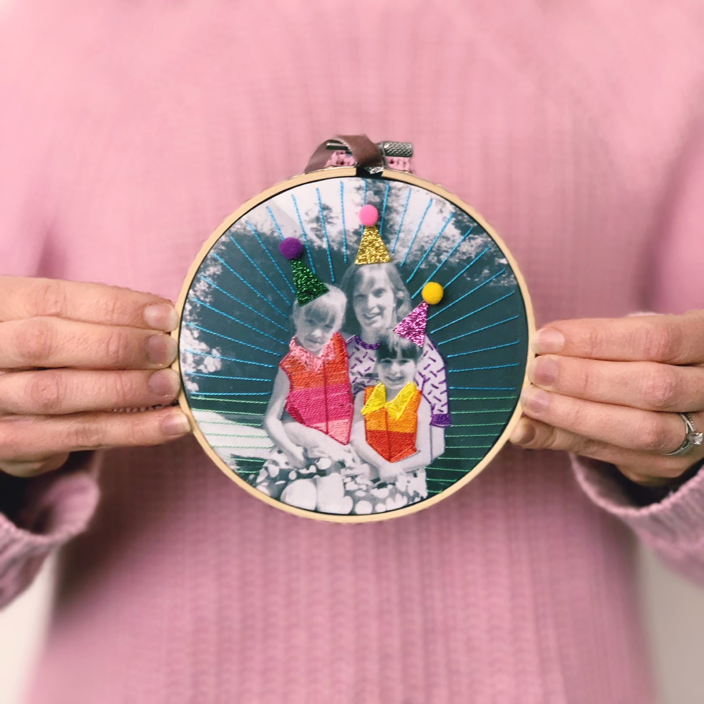Custom photo embroidery printed on fabric and displayed in a wooden hoop.